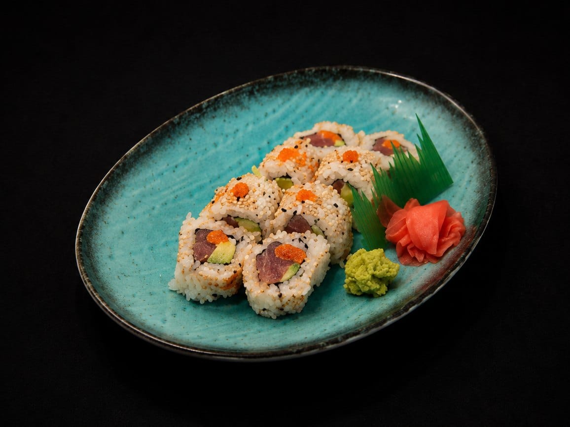 Inside-out tuna and avocado maki topped with flying fish roe