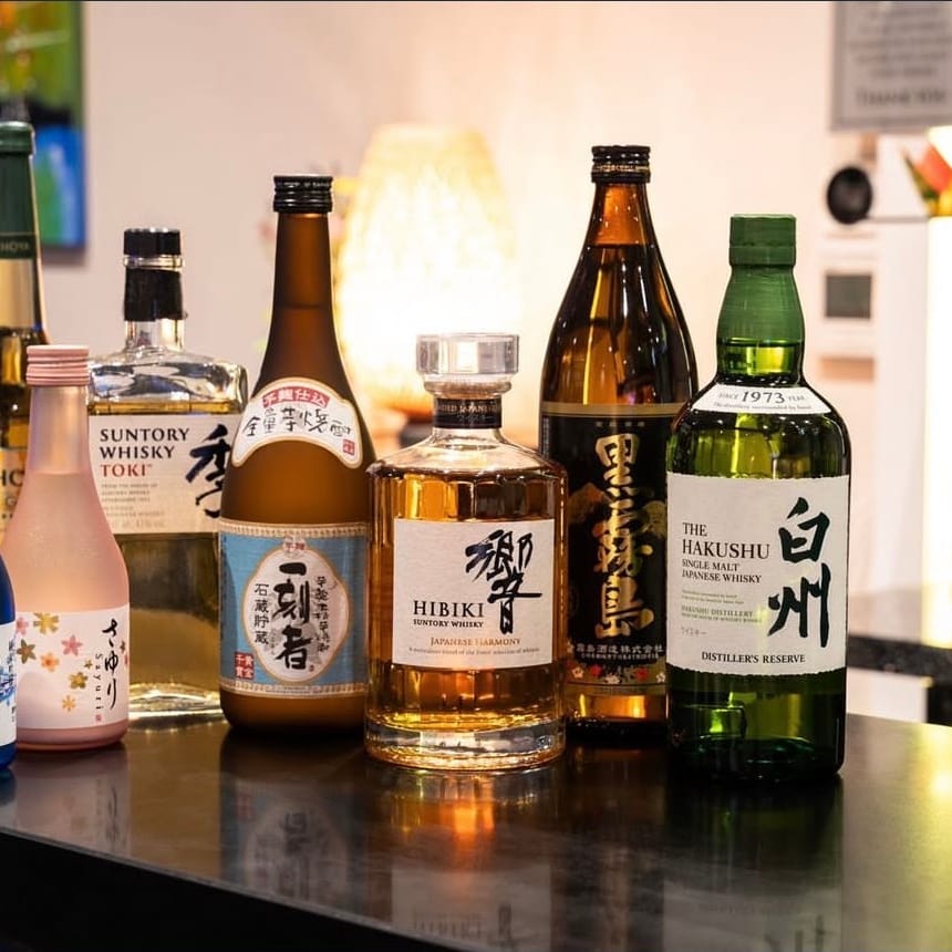 Bottles of sake, shochu and Japanese whisky on the bar at Momo